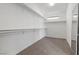 Walk-in closet with built-in shelving and carpeted floor at 283 Grand Olympia Dr, Henderson, NV 89012
