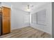 Light-filled bedroom with hardwood floors, ceiling fan and large windows at 3425 E Russell Rd # 155, Las Vegas, NV 89120