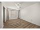 This bright bedroom offers wood-look floors, closet, and ample light from the window at 3425 E Russell Rd # 155, Las Vegas, NV 89120