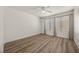 Bright bedroom featuring wood-look flooring, neutral walls, and a ceiling fan at 3425 E Russell Rd # 155, Las Vegas, NV 89120