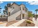 Well-maintained stucco building with exterior staircase and desert landscaping at 3425 E Russell Rd # 155, Las Vegas, NV 89120
