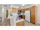 Updated kitchen featuring wood cabinetry, sleek countertops, and stainless steel appliances at 3425 E Russell Rd # 155, Las Vegas, NV 89120