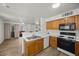 Bright kitchen with modern appliances, stainless sink, and view to balcony at 3425 E Russell Rd # 155, Las Vegas, NV 89120