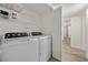 Bright laundry room featuring a washer and dryer, and wire shelves at 3425 E Russell Rd # 155, Las Vegas, NV 89120