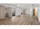 Bright living room featuring wood floors, neutral walls, and a sliding glass door to the balcony at 3425 E Russell Rd # 155, Las Vegas, NV 89120