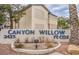 Community signage for Canyon Willow on Pecos Rd with muted tan landscaping around the sign at 3425 E Russell Rd # 155, Las Vegas, NV 89120