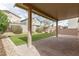 The backyard features a covered patio and artificial turf at 4512 Moon Hill Rock Ave, North Las Vegas, NV 89084