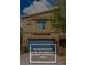 Two story home featuring a front-loading garage and desert landscaping at 4512 Moon Hill Rock Ave, North Las Vegas, NV 89084
