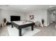 The game room features a pool table, neutral walls, and comfortable beanbag seating at 4512 Moon Hill Rock Ave, North Las Vegas, NV 89084