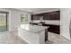 Gourmet kitchen featuring granite countertops, stainless steel appliances, and large center island at 4512 Moon Hill Rock Ave, North Las Vegas, NV 89084