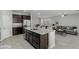 Open concept floorplan between the kitchen and living room featuring a large kitchen island at 4512 Moon Hill Rock Ave, North Las Vegas, NV 89084