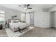 Airy main bedroom suite boasting natural light, modern decor, and an en-suite bathroom at 4512 Moon Hill Rock Ave, North Las Vegas, NV 89084