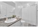 Well-lit bathroom features a vanity with granite counters, offering a clean and functional space at 456 Desoto Falls St, Indian Springs, NV 89018