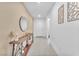 Inviting hallway with a long console table, modern decor, and tile flooring at 456 Desoto Falls St, Indian Springs, NV 89018