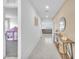 Bright hallway with console table and view into the living room and a play tent at 456 Desoto Falls St, Indian Springs, NV 89018
