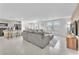 Spacious living room with neutral tones, and seamless flow from kitchen to living space at 456 Desoto Falls St, Indian Springs, NV 89018