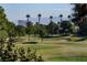 Picturesque golf course view featuring lush green fairways, mature trees, and distant mountain scenery at 4916 Mount Pleasant Ln, Las Vegas, NV 89113