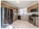 Well-lit kitchen featuring stainless steel appliances, granite countertops, and neutral-toned cabinetry at 4916 Mount Pleasant Ln, Las Vegas, NV 89113