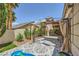 Spacious backyard featuring a shaded gazebo, patterned patio, and manicured landscaping at 521 Dawn Cove Dr, Henderson, NV 89052