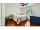 Bedroom with wood floors, large window with shutters, and neutral decor at 521 Dawn Cove Dr, Henderson, NV 89052
