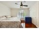 Bedroom with wood floors, a large window with shutters, and a sliding door closet at 521 Dawn Cove Dr, Henderson, NV 89052