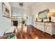 Spacious foyer with hardwood floors, white wainscoting, and ample natural light at 521 Dawn Cove Dr, Henderson, NV 89052