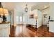 Bright foyer with hardwood floors, white walls, and a view of the front entrance at 521 Dawn Cove Dr, Henderson, NV 89052