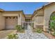 Inviting front entrance with decorative tiled walkway, gated entry, and landscaped surroundings at 521 Dawn Cove Dr, Henderson, NV 89052