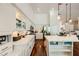 Modern kitchen with stainless steel appliances, sleek countertops and center island with breakfast bar at 521 Dawn Cove Dr, Henderson, NV 89052