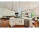 Open-concept kitchen features a large island, stainless steel appliances, and hardwood floors at 521 Dawn Cove Dr, Henderson, NV 89052