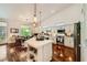 Bright, open kitchen boasts a large island, white cabinets, and modern stainless steel appliances at 521 Dawn Cove Dr, Henderson, NV 89052