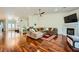 Spacious living room featuring hardwood floors, a fireplace, and an open layout at 521 Dawn Cove Dr, Henderson, NV 89052