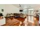 Open living area with hardwood floors, a fireplace, and large windows offering plenty of light at 521 Dawn Cove Dr, Henderson, NV 89052