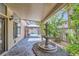 Covered patio with decorative fountain and lush garden offering relaxation at 521 Dawn Cove Dr, Henderson, NV 89052