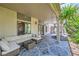 Covered patio featuring a comfortable seating area, perfect for outdoor relaxation at 521 Dawn Cove Dr, Henderson, NV 89052