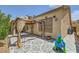 This home has a lovely outdoor patio with an awning, patterned tile, and ample room for entertaining at 521 Dawn Cove Dr, Henderson, NV 89052