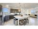 Open concept kitchen with white countertops, stainless steel appliances, and seating at the island at 5368 Knitmore Ct, Las Vegas, NV 89139