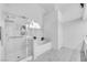 Bright bathroom features a walk-in shower and a separate soaking tub, creating a spa-like experience at 9155 Bush Poppy Ave, Las Vegas, NV 89147