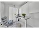 Bright home office featuring sleek white finishes, modern desk, and ample built-in storage at 9155 Bush Poppy Ave, Las Vegas, NV 89147