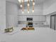 Gourmet kitchen island with sink and modern lighting at 9155 Bush Poppy Ave, Las Vegas, NV 89147