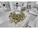 Chic bouquet sits inside of an open concept living area with marble floors at 9155 Bush Poppy Ave, Las Vegas, NV 89147