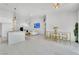 Open-concept living area with modern kitchen, bar seating, and stylish decor at 9155 Bush Poppy Ave, Las Vegas, NV 89147