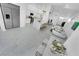 Spacious living room with modern decor, marble floors, and stainless steel refrigerator at 9155 Bush Poppy Ave, Las Vegas, NV 89147