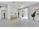 Open-concept living area with natural light and a view to outdoor living at 9155 Bush Poppy Ave, Las Vegas, NV 89147