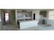 Bright, spacious kitchen with a large island and modern gray cabinetry, perfect for cooking at 9556 Hinson St, Las Vegas, NV 89139