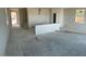 Spacious open-concept living area with a staircase and rough-in for kitchen buildout at 9556 Hinson St, Las Vegas, NV 89139