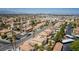 Expansive aerial view showcasing the neighborhood with lush trees, pools, and well-maintained homes at 9604 Summer Cypress St, Las Vegas, NV 89123