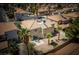 Aerial view of backyard with patio and seating area, plus mature palm trees at 9604 Summer Cypress St, Las Vegas, NV 89123