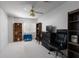 Bright bedroom features a ceiling fan, bookshelves, and a comfortable workspace at 9604 Summer Cypress St, Las Vegas, NV 89123