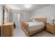 Comfortable bedroom boasts natural light, a wooden bed, and matching furniture at 9604 Summer Cypress St, Las Vegas, NV 89123